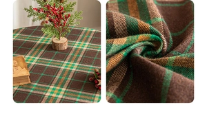 Macro detail of thick green plaid Christmas tablecloth showing soft flannel texture