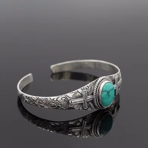 Vintage bohemian turquoise cross bangle in antique silver finish with engraved details