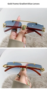 Detail of gold frame pilot sunglasses with gradient blue lenses and wood texture temples