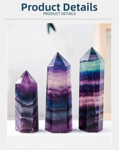 Detailed view of three natural rainbow fluorite hexagonal pillars in varying heights