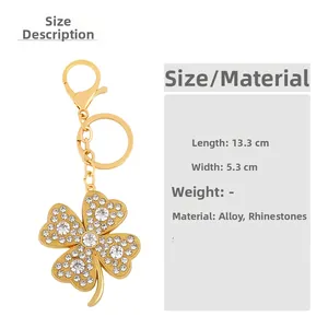 Detailed size specifications of the gold clover keychain with inlaid rhinestones
