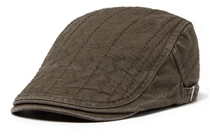 Detail of vintage brown cotton beret showing wave quilted texture and metal side buckle
