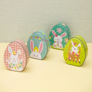 Set of four egg-shaped Easter tin boxes with cute bunny patterns for candy gift packaging