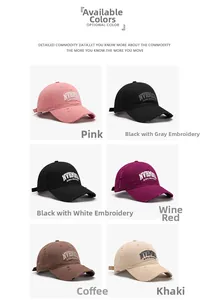 Detail of vintage distressed baseball caps with NVRLND embroidery in multiple colors