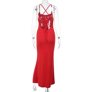 Detail view of the elegant red backless evening dress with thin crisscross straps