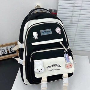 Large capacity black and white contrast canvas backpack with cute cartoon pendants