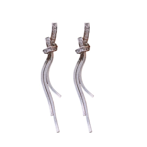 Silver needle tassel knot earrings with sparkling cubic zirconia in a long drop design