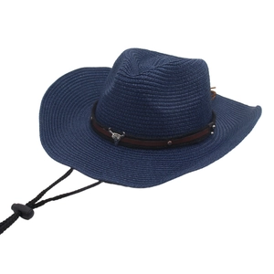 Close-up of navy blue woven straw cowboy hat with silver bull head metal ornament
