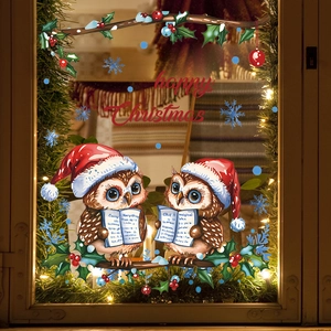Christmas window clings featuring owls on branches with Happy Christmas greeting text