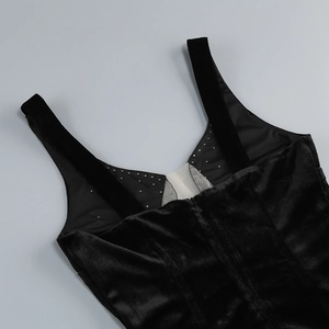 Close-up of black velvet dress with delicate rhinestone trim and hidden zipper detail