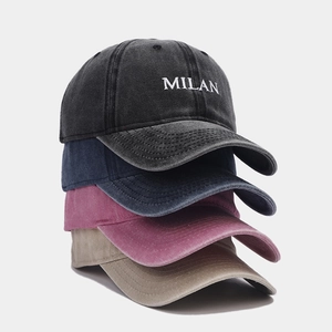 Distressed washed cotton baseball caps with MILAN embroidery in four classic vintage colors