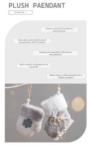 Detail of plush Christmas stockings and mittens with wooden snowflake and reindeer accents