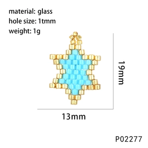 Macro shot of 19mm handmade blue and gold star pendant with glass bead weaving details