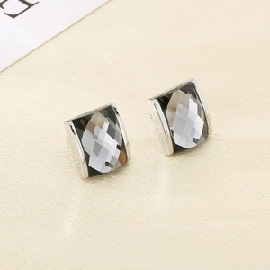 Detail of square smoke gray faceted crystal earrings with silver-plated base