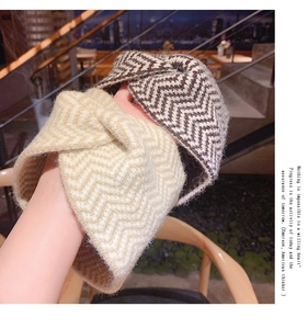 Detail of knitted zigzag hairbands showing soft wool texture and twist knot design