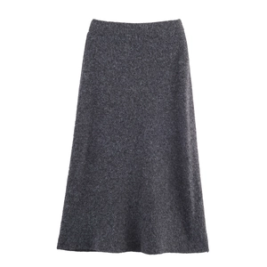 Detail of dark grey knitted A-line skirt with belt showing texture and minimalist design