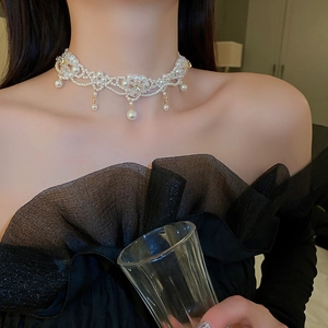 Detail showing vintage lace pearl choker with flower crystal and teardrop pendants