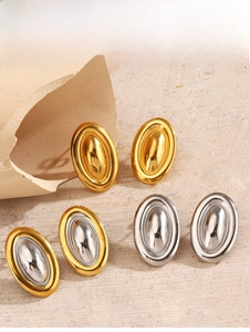 Detail showing geometric oval earrings in gold, silver, and two-tone polished finishes