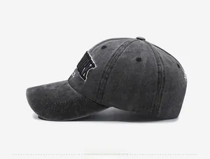 Close-up of vintage washed baseball cap featuring 3D YORK embroidery and side stitching