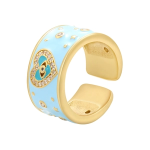 Detail of gold enamel ring with heart, evil eye design and micro-pave zircons