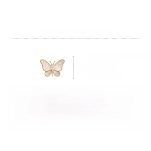 Detailed view of butterfly brooch featuring mother-of-pearl wings and gold plating
