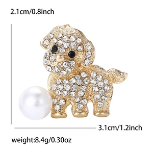 Golden puppy brooch with clear crystals and pearl on white background with dimensions