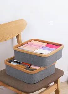 Stackable grey fabric organizer boxes with wood trim for bras and socks storage