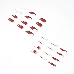 Faux ongles bordeaux et crème avec nœuds rouges 3D et motifs de cœur rétro