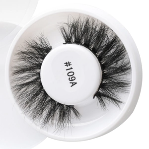 Close-up of model #109A black dense false eyelashes in a white round storage box