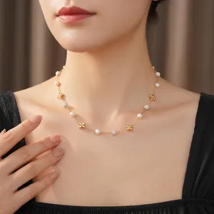 Gold plated necklace with pearls, zircon flower charms, and sparkling pave beads