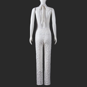 Detailed back view of white lace halter jumpsuit with elegant backless cutout design
