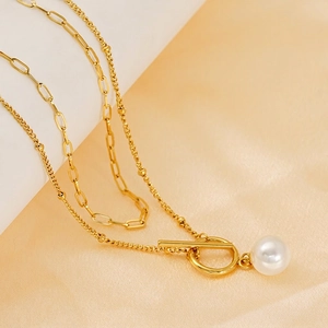 Double-layer gold chain necklace with white pearl pendant and stylish OT toggle clasp