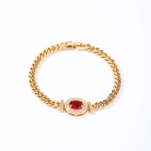Golden Cuban link bracelet with oval red stone and sparkling white pavé crystals
