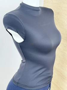 Close-up of black body-con athletic tee with mock neck and high-stretch fabric