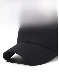 Detailed close-up of a black baseball cap featuring firm brim and precision stitching lines