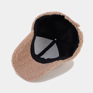 Internal view of thick khaki lamb wool baseball cap with black mesh lining and sweatband