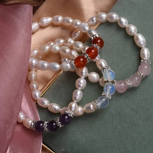 Elastic freshwater pearl bracelet stack with agate and crystal beads in a gift display
