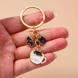 Cute black cat and tea cup enamel keychain in gold metal finish for animal lovers