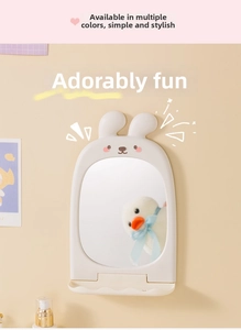 Wall-mounted bunny makeup mirror with cute ears and a small storage tray for combs