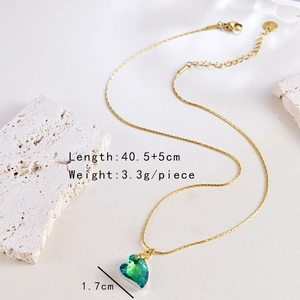 Detail view of gold chain necklace with green heart pendant and size specifications
