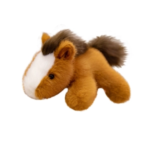 Plush brown horse toy in a lying position with white stripe and fluffy dark brown mane