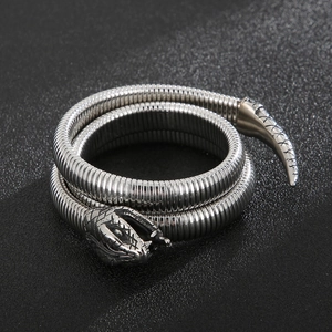 Macro shot of silver stainless steel snake bracelet with realistic scales and punk style