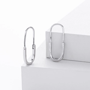Detail shot of S925 sterling silver safety pin earrings with polished finish and hallmark