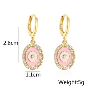 Detailed view of evil eye earrings with pink enamel and dimensions 2.8cm by 1.1cm