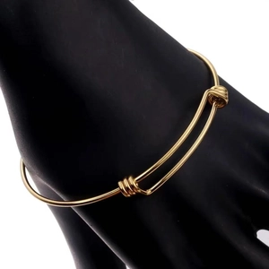 Adjustable 304 stainless steel bangle in gold finish with sliding knot design