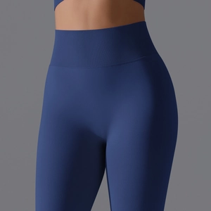 Macro shot of high-waist ribbed seamless yoga pants in royal blue with textured fabric