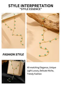 Detail of Y-shaped gold necklace with turquoise beads on elegant rustic background