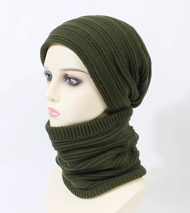 Detail view of army green knitted beanie and neck warmer set with textured rib patterns