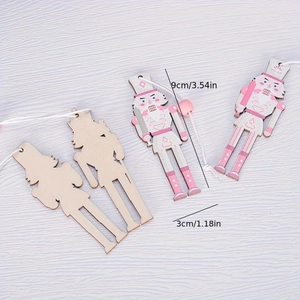 Detail of wooden nutcracker ornaments showing size 9x3cm and pink painted finish