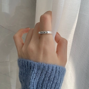 Minimalist 925 sterling silver smile ring featuring a creative polished metal design